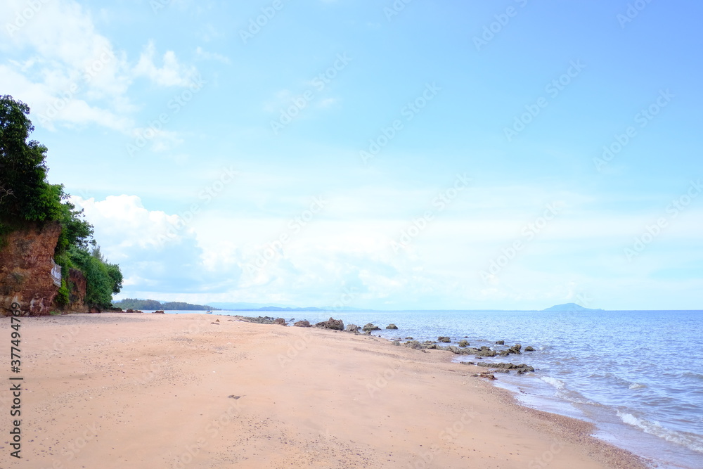 Beautiful beach with white sand and blue sky with clouds in sunny day. 