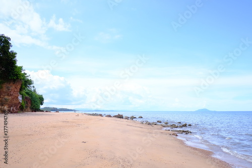 Beautiful beach with white sand and blue sky with clouds in sunny day. 