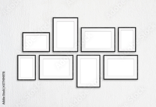 Black photo frames, eight set collection on white textured wall, interior decor mock up