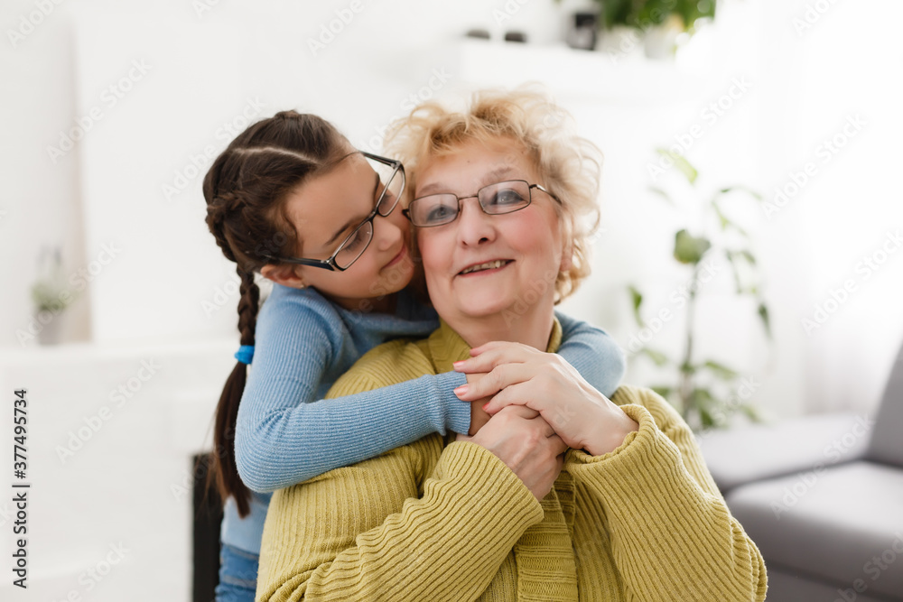 Grandmother and granddaughter portrait, embraced Grandmother and granddaughter portrait, embraced
