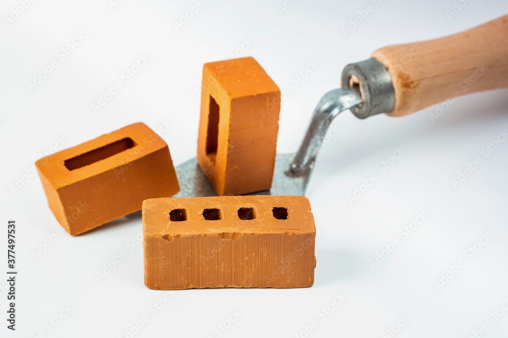 Isolated trowel and brick blocks on white background Isolated trowel and brick blocks on white background