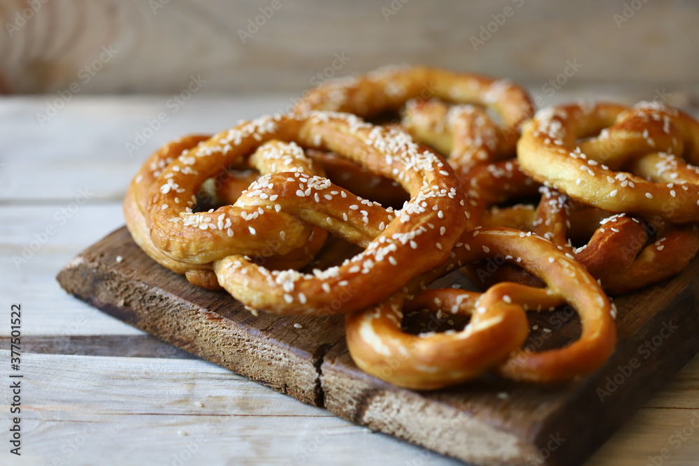 Fresh pretzels on a wooden surface. Preparing for Oktoberfest. Fresh pretzels on a wooden surface. Preparing for Oktoberfest.