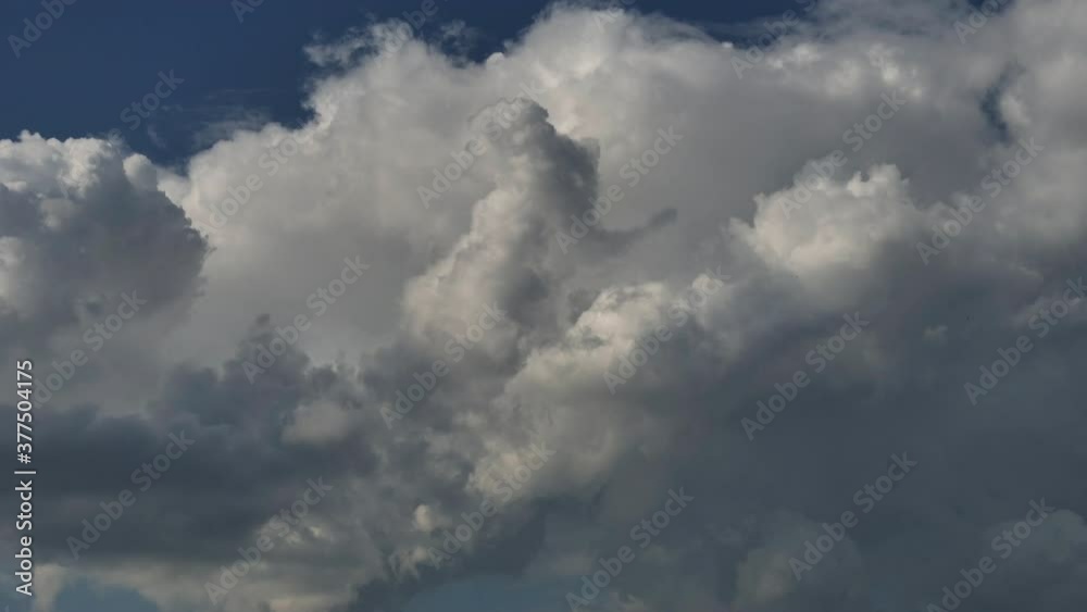 Cumulus clouds fast flying sky timelapse.
