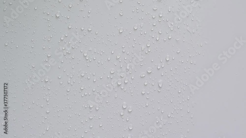 Water droplets running through the wall