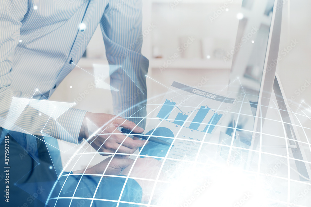 Double exposure of world map hologram with man working on computer on background. Concept of worldwideweb. Double exposure of world map hologram with man working on computer on background. Concept of worldwideweb.