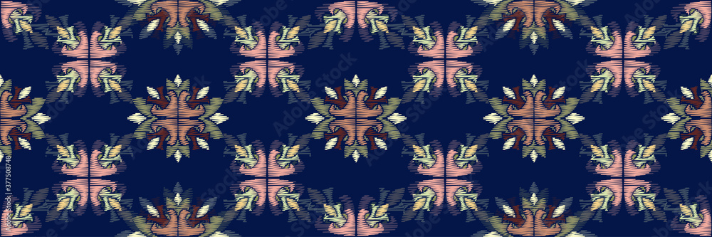 Naklejka premium Colorful Ikat ornamentel seamless pattern for textile, wallpaper, card or wrapping paper