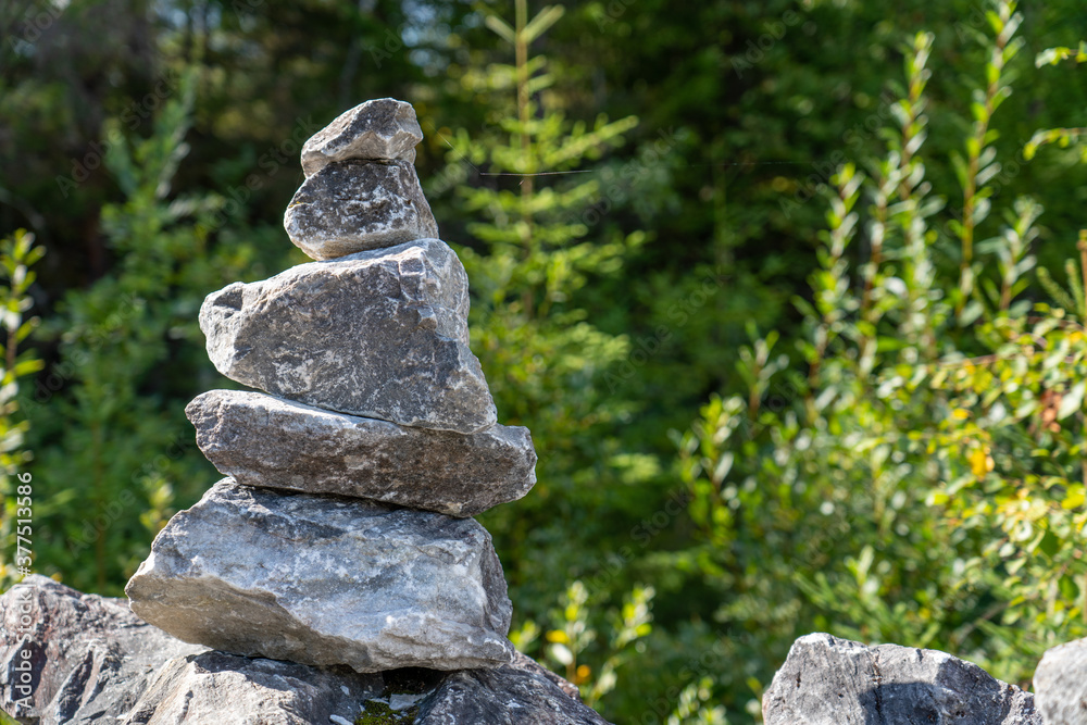 Stone stack in green wood Stone stack in green wood