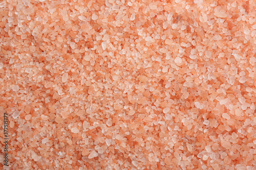 Pink himalayan salt as background, top view