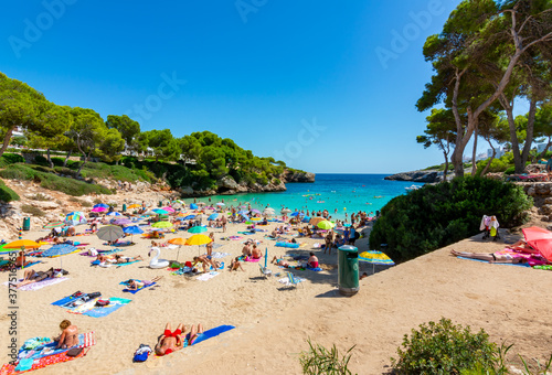 Fototapeta Naklejka Na Ścianę i Meble -  Mallorca, Spain - September 2019: People on Esmeralda beach in Cala D'Or