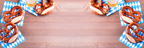 Fototapet Oktoberfest background with beer and pretzels and traditional bavarian decor clo