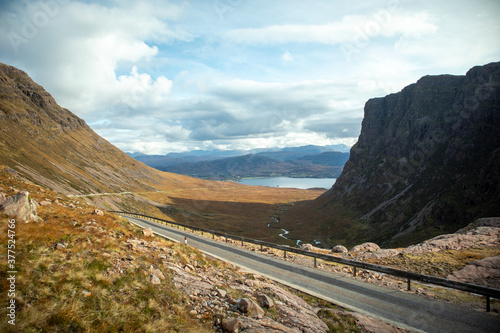 Road to the lake in valley between mountains