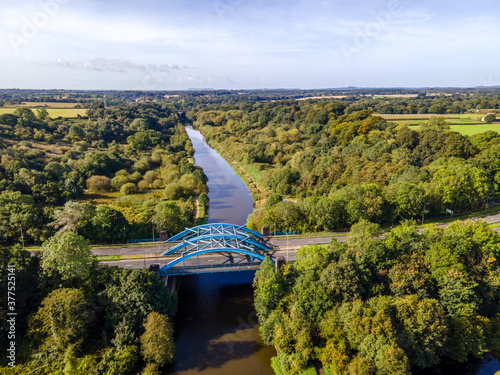 The Hartford Bridge, or Blue Bridge, is a single-span road bridge crossing the River Weaver at Hartford, Cheshire in England