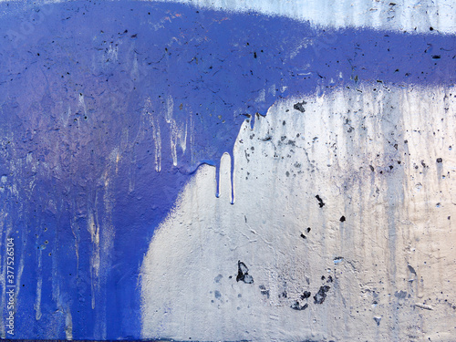 Abstract, damage to walls with many colors. Style of landscape. Rough concrete surface with cracks, scratches and paint stains. Great background or texture.