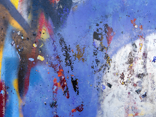 Abstract, damage to walls with many colors. Style of landscape. Rough concrete surface with cracks, scratches and paint stains. Great background or texture.