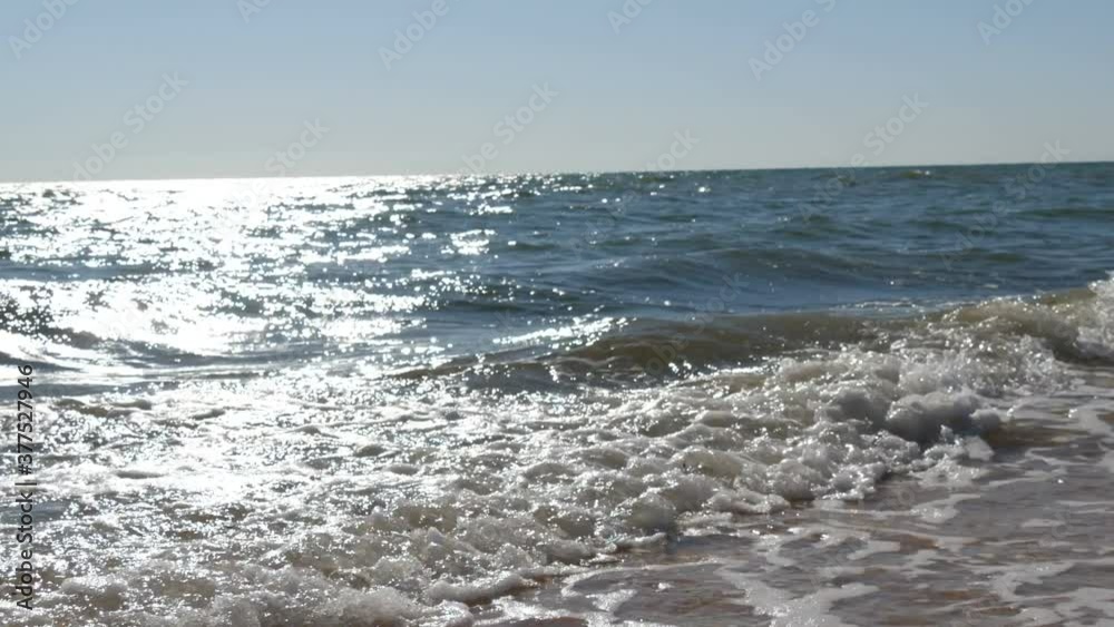 Sea waves, sand on the coast of the Azov Sea, summer day, relax concept. Sea waves, sand on the coast of the Azov Sea, summer day, relax concept.