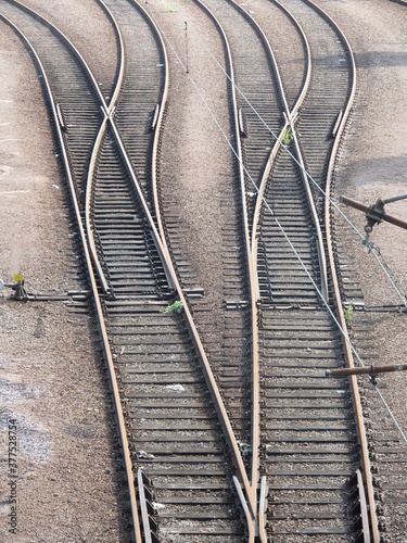 A railway tracks seen from the above. Concepts of train transport, crossroads, travel, direction and destination.
