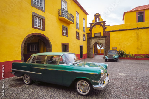 Funchal, Madeira, Portugal - 12/13/2015: Luxury old timer car in the courtyard of the Sao Tiago fort, dreamy style