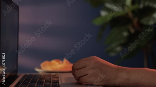 Drinking Beer with Friends via the Internet at Home. Person Celebrating by Cold Alcohol Drinks and Potato Chip Snack at Night while Using Computer laptop. Static shot