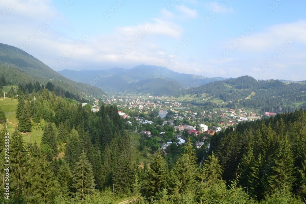 panorama of the mountains, village in the valley between the hills