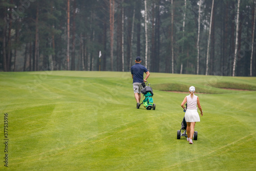 The Golfers walk across the field during the tournament.