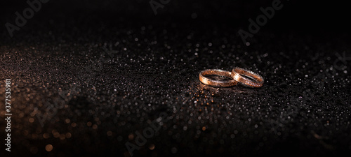 Wedding rings in raindrops