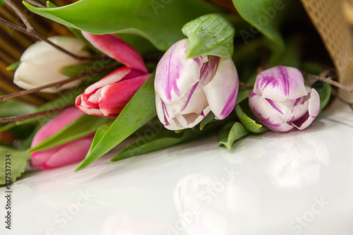 Fototapeta Naklejka Na Ścianę i Meble -  Delicate pink tulips as background. Retro filter. Soft color. A bouquet of flowers for design of postcards, invitations, congratulations on holiday, birthday
