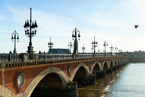 Pont de pierre (Stone Bridge) on a bright sunny day, Bordeaux, France © vladislavmavrin