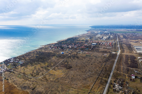 Beautiful view of the sea from a bird's eye view. The stunning cloudy sky reflected on the beach Fontanka, Odessa, Ukraina. Concept of leisure and sea travel.