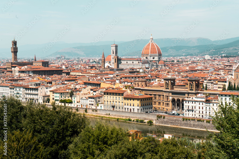 Fototapeta premium This is a beautiful shot taken from a hike up a mountain to get to this wonderful view all over Florence, Italy. You can see the Cathedral overshadowing the city with its impressive dome.