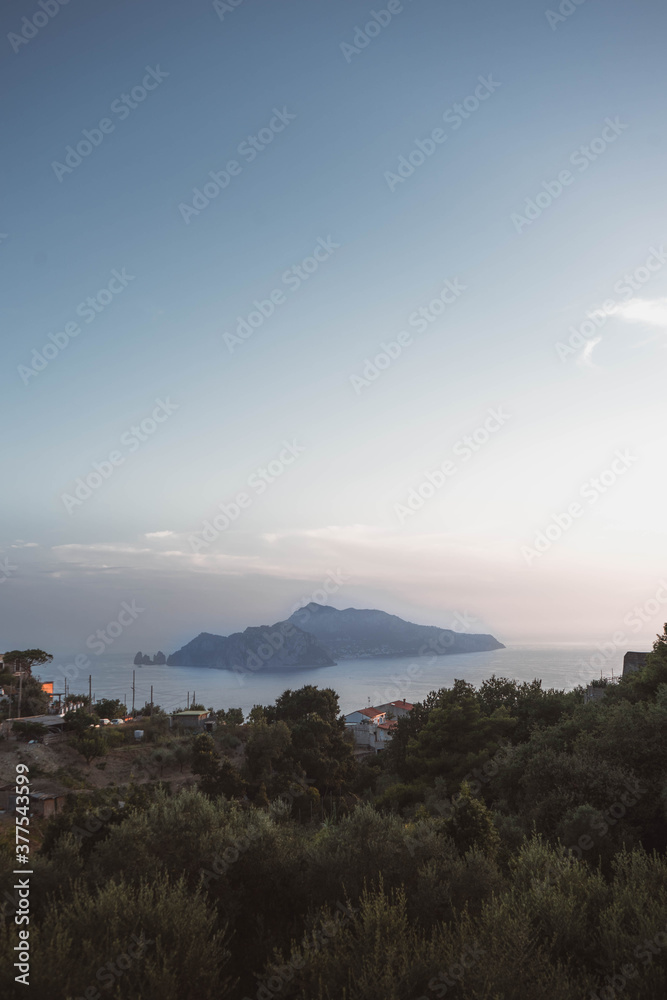 sunset over capri, italy, From the top of a mountain you can see the historic island in all its glory