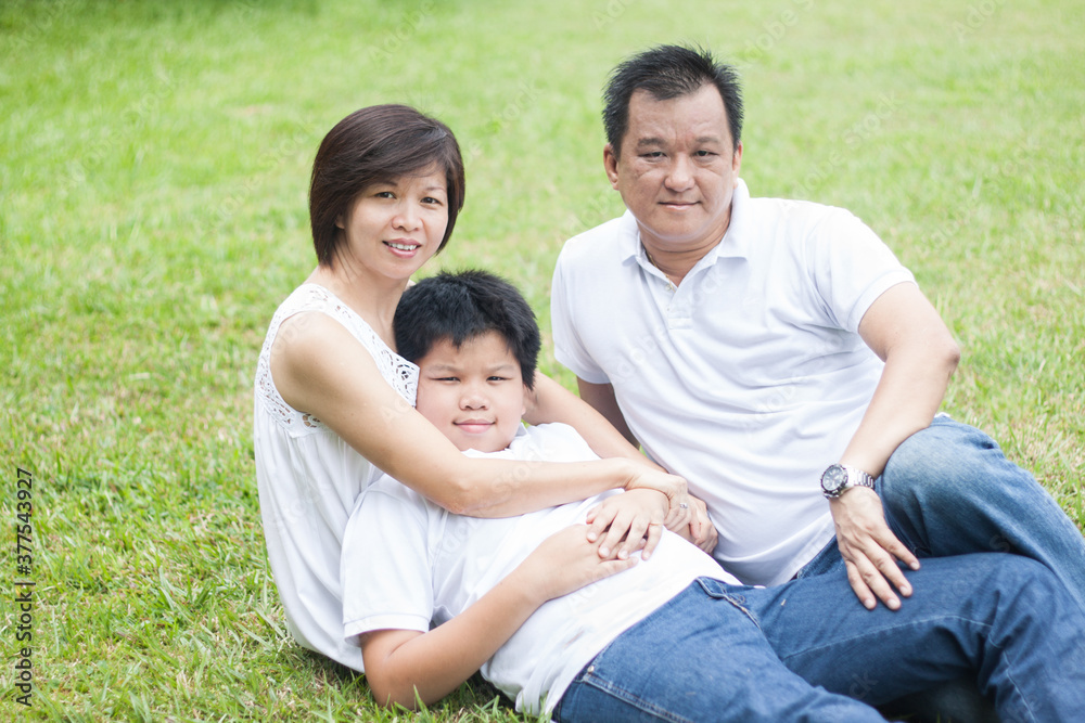Asian family enjoying happy and joyful day out in outdoor nature Asian family enjoying happy and joyful day out in outdoor nature