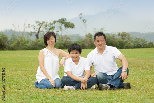 Asian family enjoying happy and joyful day out in outdoor nature