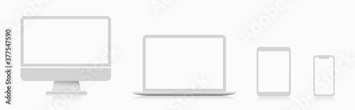Realistic set of white monitor, laptop, tablet and smartphone. Technology devices with empty display. Collection of modern digital devices. Vector illustration.