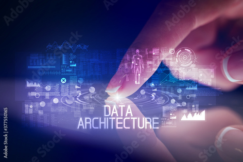 Finger touching tablet with web technology icons and DATA ARCHITECTURE inscription
