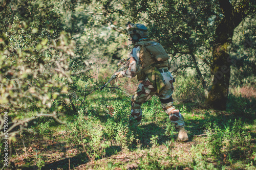 Soldier in a combat situation. Men play airsoft.