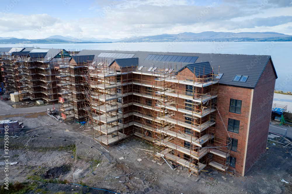 House development construction site in progress aerial view House development construction site in progress aerial view
