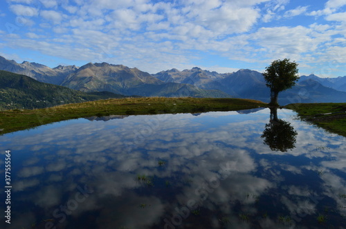 Reflections of the mountains around Lake Como in Lombardy, Northern Italy