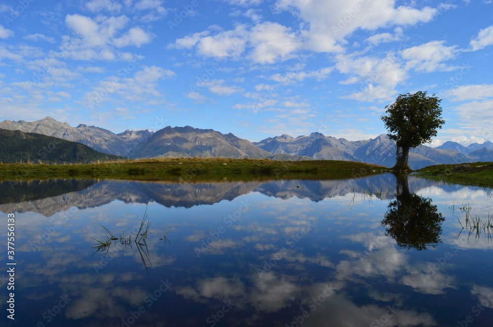 Reflections of the mountains around Lake Como in Lombardy, Northern Italy