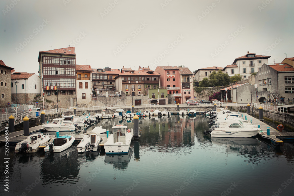 Old picturesque town in Asturias with a small port full of boats