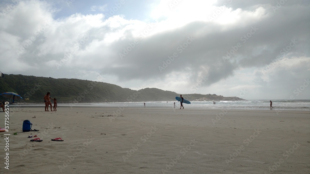 people walking on the beach