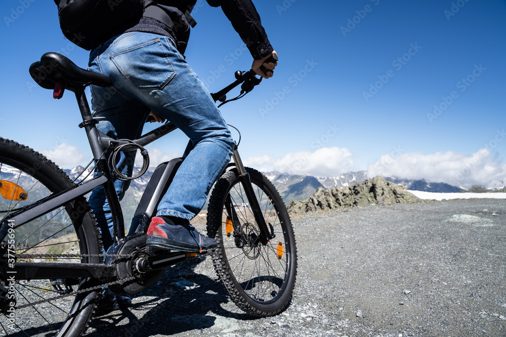 Naklejka premium Man Riding Electric Mountain Bike