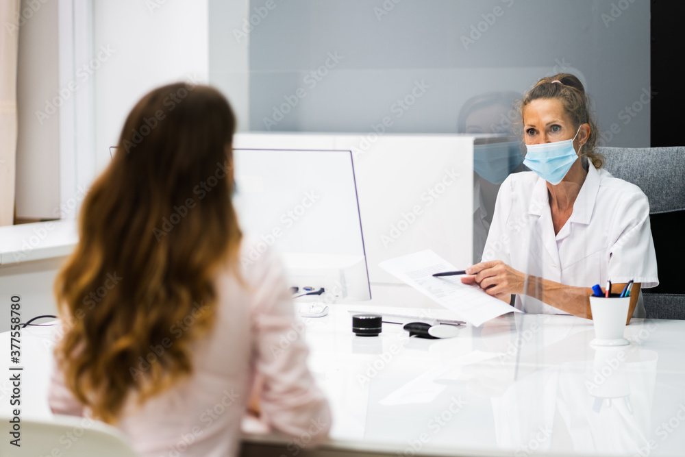 Doctor Talking To Patient At Meeting About Pregnancy Doctor Talking To Patient At Meeting About Pregnancy