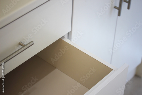 Fotografering Empty drawer in a new cupboard