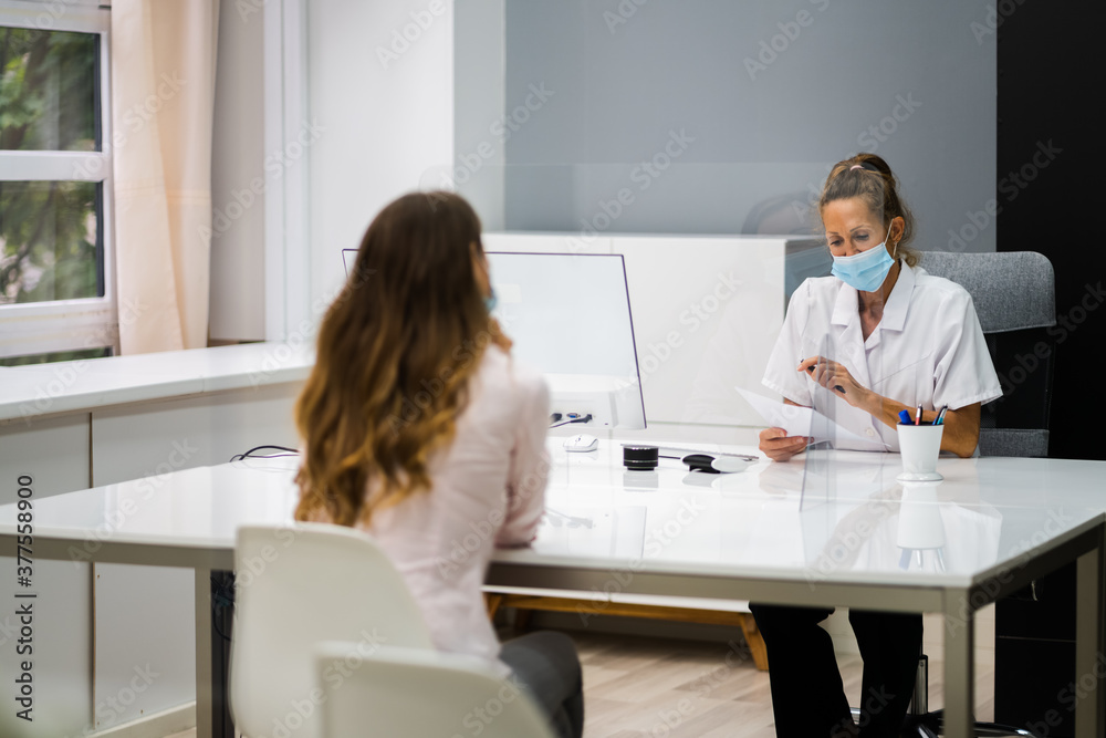 Doctor Talking To Patient At Meeting About Pregnancy Doctor Talking To Patient At Meeting About Pregnancy