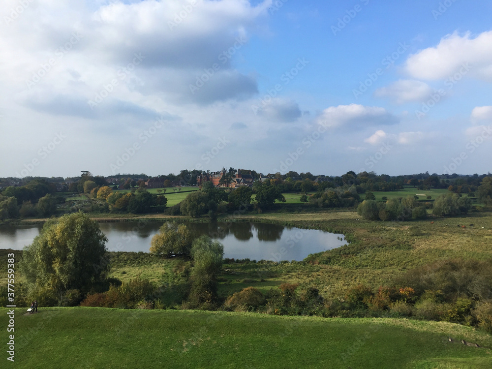 Bucolic landscape seen from Framlingham Castle in the county of Suffolk England with lake, lawn and trees Bucolic landscape seen from Framlingham Castle in the county of Suffolk England with lake, lawn and trees