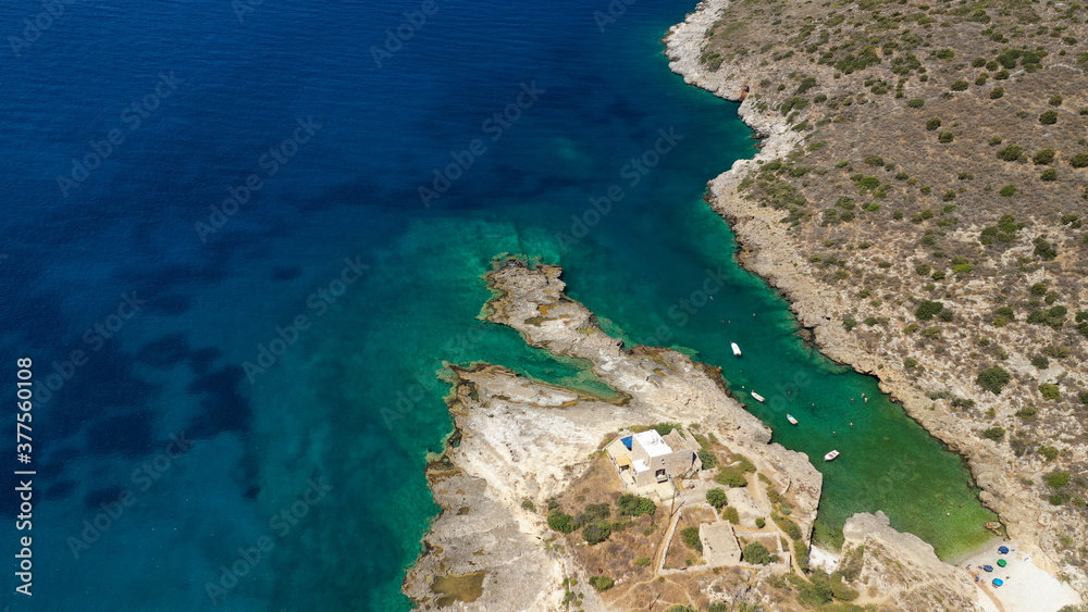 Aerial drone photo of beautiful fishing seaside village of Mezapos with crystal clear emerald beach in Mani Peninsula, Lakonia prefecture, Peloponnese, Greece