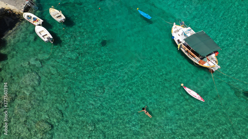 Aerial drone photo of beautiful fishing seaside village of Mezapos with crystal clear emerald beach in Mani Peninsula, Lakonia prefecture, Peloponnese, Greece