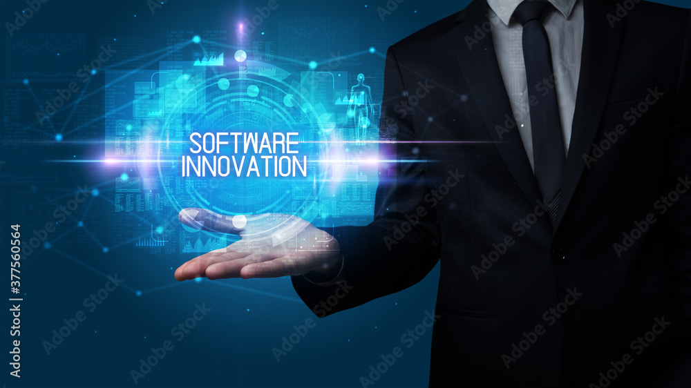 Man hand holding SOFTWARE INNOVATION inscription, technology concept