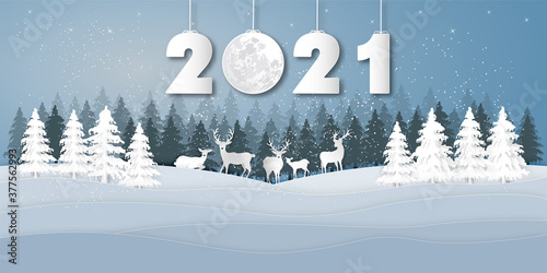 Paper art, cut and digital craft style of Reindeers or deers in village in the snow wintry season with trees as Merry Christmas and Happy New Year 2021 concept. vector illustration