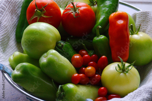 Fresh green vegetables and tomatoes